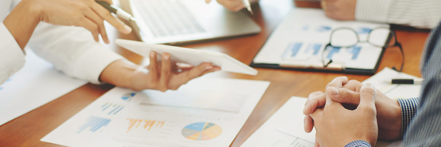 business people discussing data document business people discussing data document