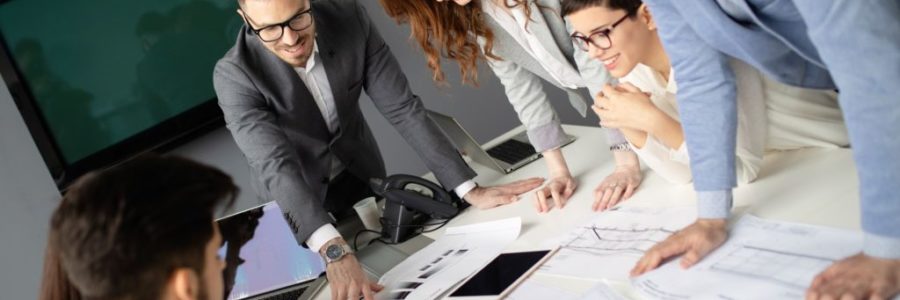 Group of business people collaborating in office Group of business people collaborating in office