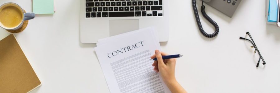 businesswoman signing contract document at office