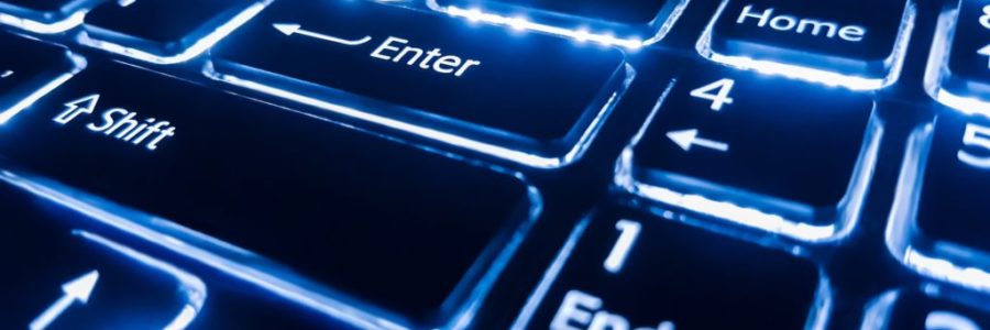 Neon keyboard with enter button. Focus on the . Neon keyboard with enter button. Focus on the .