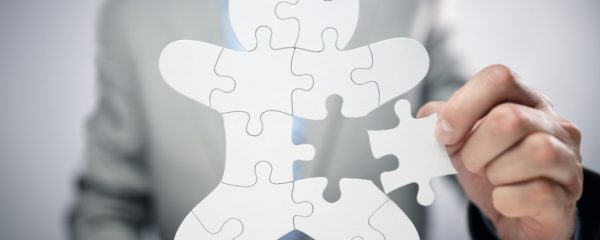 Businessman assembling jigsaw puzzle human team employee Businessman assembling jigsaw puzzle human team employee
