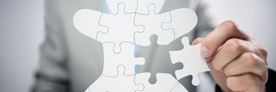 Businessman assembling jigsaw puzzle human team employee Businessman assembling jigsaw puzzle human team employee