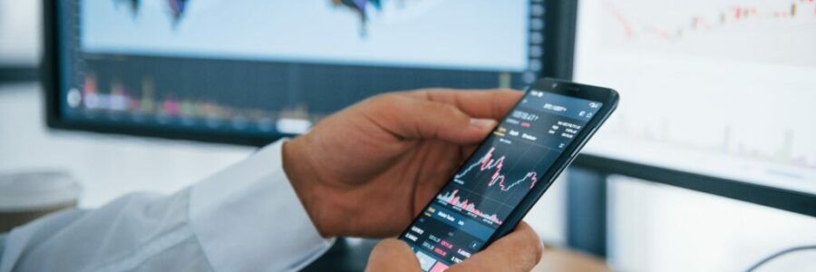 Businessman is in office with multiple screens. Conception of exchange and money Businessman is in office with multiple screens. Conception of exchange and money