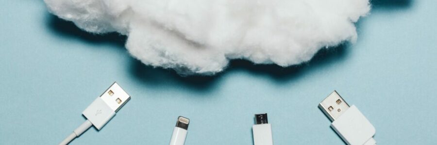 Four white wires laying under a white cotton cloud. Four white wires laying under a white cotton cloud.