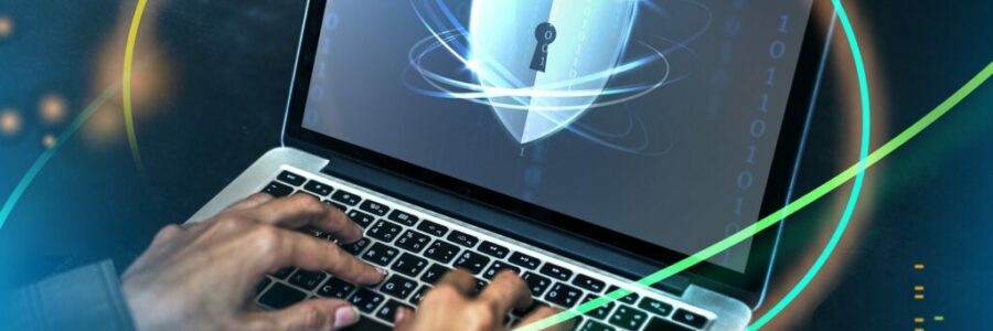 Hacker cracking the security code on a laptop Hacker cracking the security code on a laptop