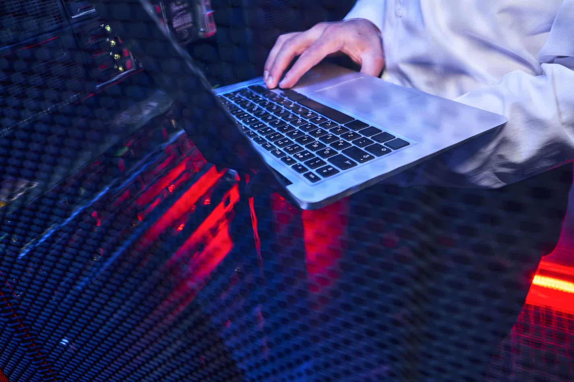 Busy maintenance administrator controlling operational server rack optimal functioning