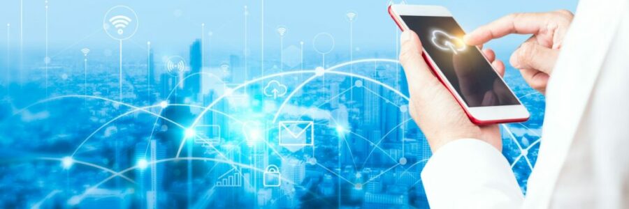 Man's hand using smartphone to connecting data information and blurred city background Man's hand using smartphone to connecting data information and blurred city background